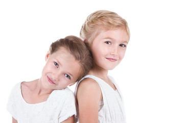 Two best friends sitting back to back