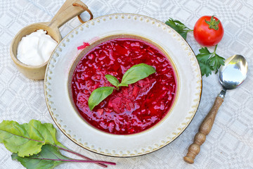 Beet root soup with sour cream and basil