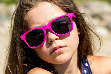 Portrait of little young girl kid at sea. Summer.