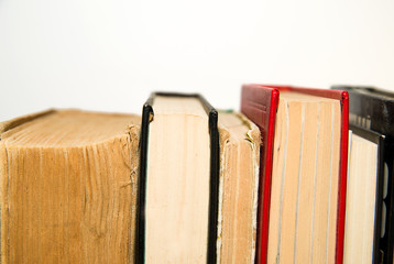 A few old books are next to each other