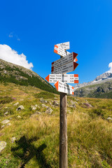 Directional Trail Signs in Mountain - Italian Alps / Typical directional trail signs in mountain in the National Park of Adamello Brenta. Trentino Alto Adige, Italy