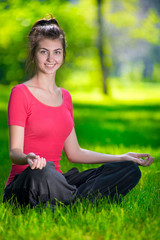 Fototapeta premium Young woman doing yoga exercises