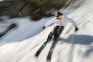 Motion blurred image of an expert skier.