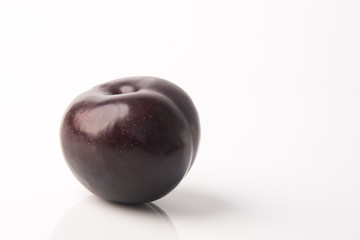 Ripe plum fruit on a background