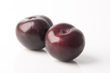 Ripe plum fruit on a background