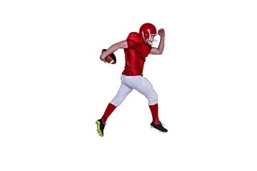 Fototapeta na wymiar American football player running with the ball