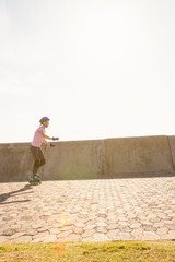 Focused sporty blonde skating