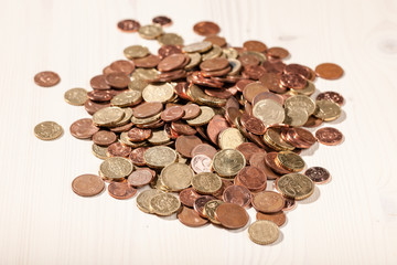 Coins on wooden table