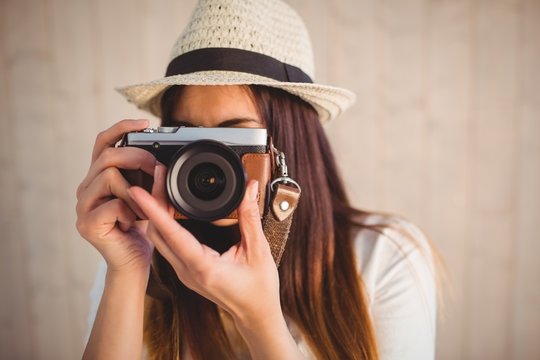 Pretty hipster using her vintage camera