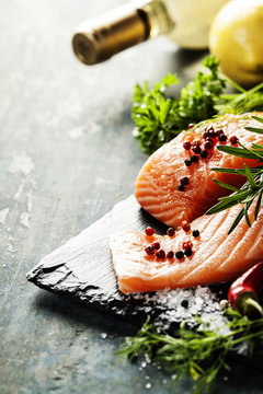 Delicious  portion of  fresh salmon fillet  with aromatic herbs,