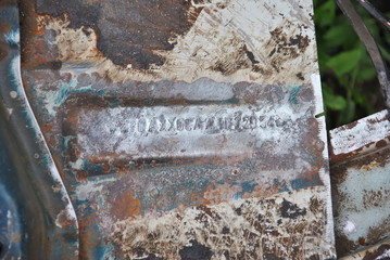 Danaged vehicle identification number on the floor of old car