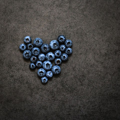 The heart of blueberry on a grey background