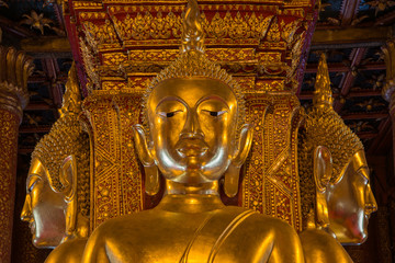 Golden Buddha image in temple of Wat Phumin in Nan, Thailand