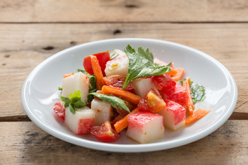 Crab stick spicy salad with vegetable.