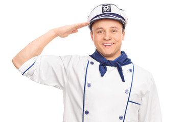 Young sailor saluting towards the camera