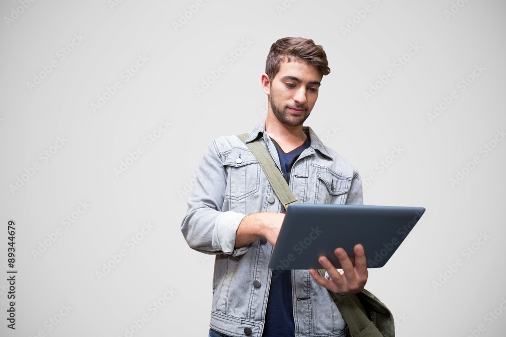 Poster composite image of student using tablet in library