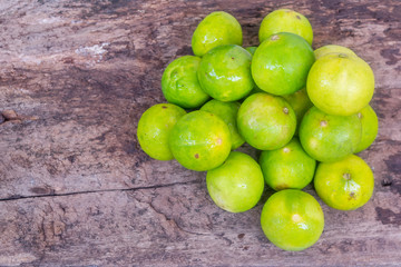 Lime green on wooden background