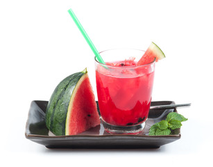 Watermelon juice in a glass on a white background