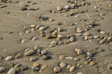 Fototapeta na wymiar Stones and sand beach