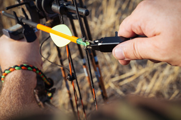 Hunter in camouflage with his bow 