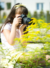 Girl taking picture on natural