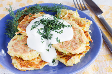 fried zucchini fritters with sour cream