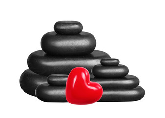Spa stones and red heart isolated on white