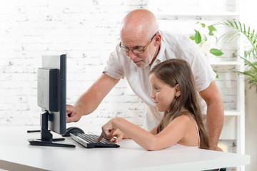 professor and child with a computer