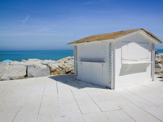 Small white cottage by the sea