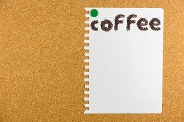 cork board with sticky note pinned..