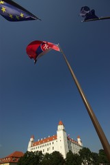 Waving flags above the Bratislava castle after Slovak integration with Europe union.