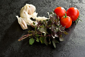 Fototapeta na wymiar bunch of basil, tomatoes and garlic