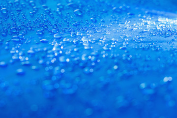 Rain Water droplets on blue fiber