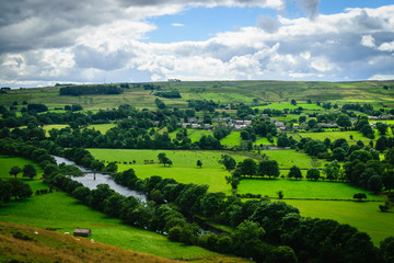 Meandering River making its way through lush green rural farmlan