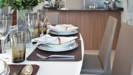 elegant table set in modern style dining room interior