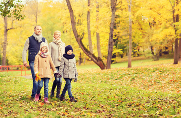 Naklejka na ściany i meble happy family in autumn park