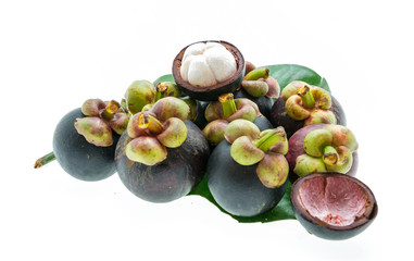 Mangosteen fruit and cross section showing the thick purple skin
