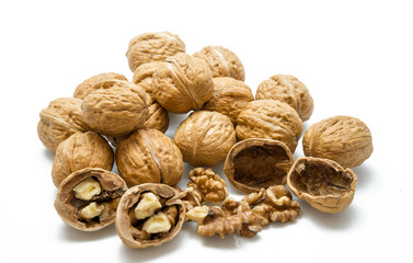 walnut and a cracked walnut on the white background