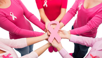 close up of women with cancer awareness ribbons