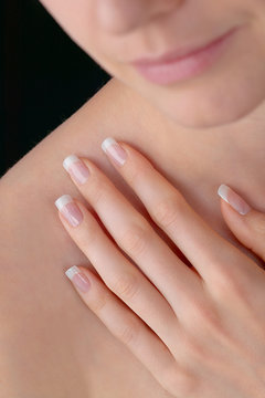 Young beauty with polished nails