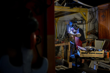 Metal worker standing in workshop