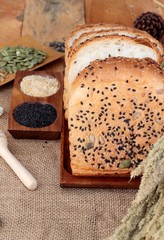 Brown bread with whole grain cereals of sliced and milk.