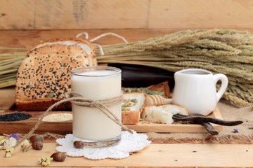 Brown bread with whole grain cereals of sliced and milk.