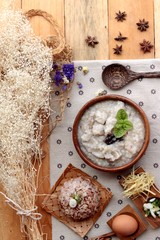 Brown rice porridge put pork and brown rice with soft-boiled egg
