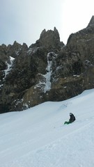 Skiing along cliff