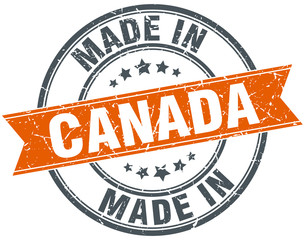 Canada orange grunge ribbon stamp on white