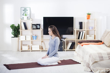 Girl exercise in the living room