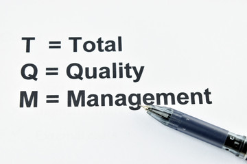 Fototapeta premium TQM total quality management with back pen