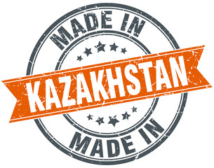 Kazakhstan orange grunge ribbon stamp on white