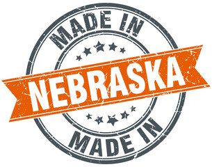 Nebraska orange grunge ribbon stamp on white